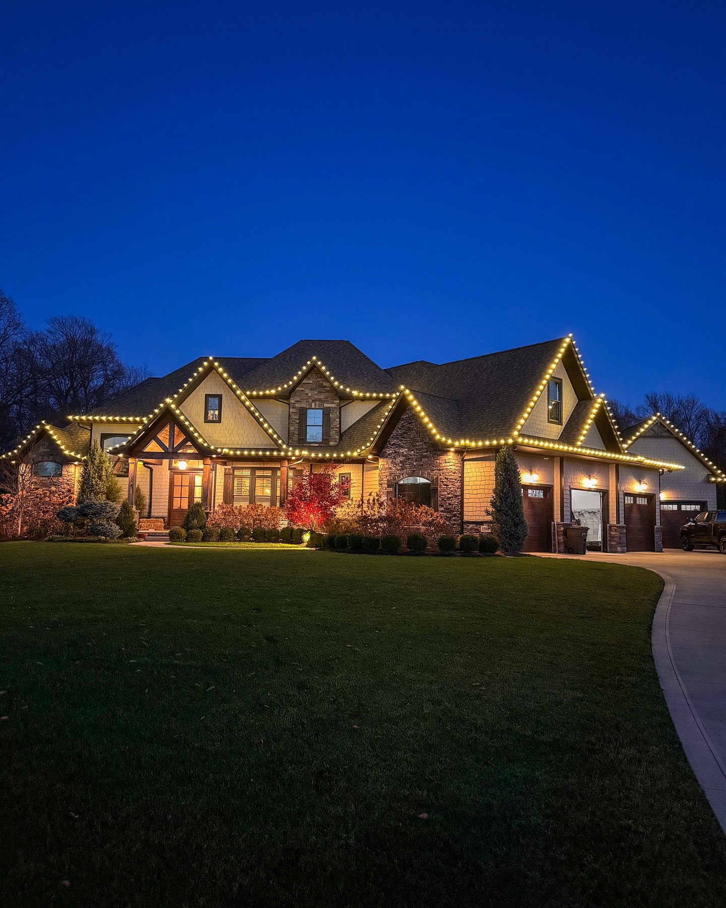 Elegant Christmas light installation with warm white lights on modern home