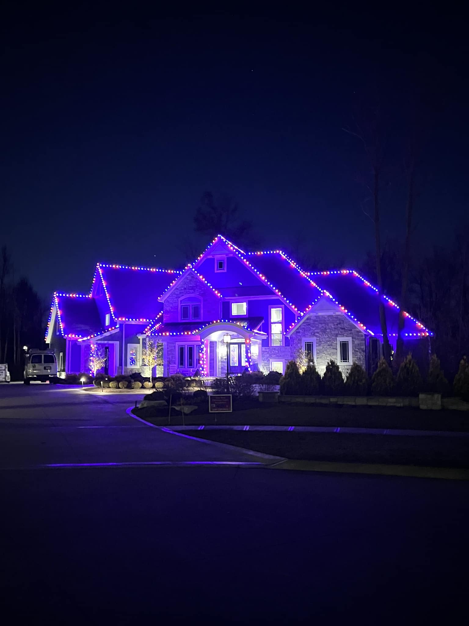 Stunning residential Christmas light display with multi-colored lights